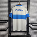 Camisa Universidade Católica Home 23/24 - Torcedor Under Armour Masculina - Branco