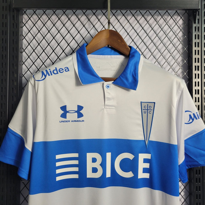 Camisa Universidade Católica Home 23/24 - Torcedor Under Armour Masculina - Branco
